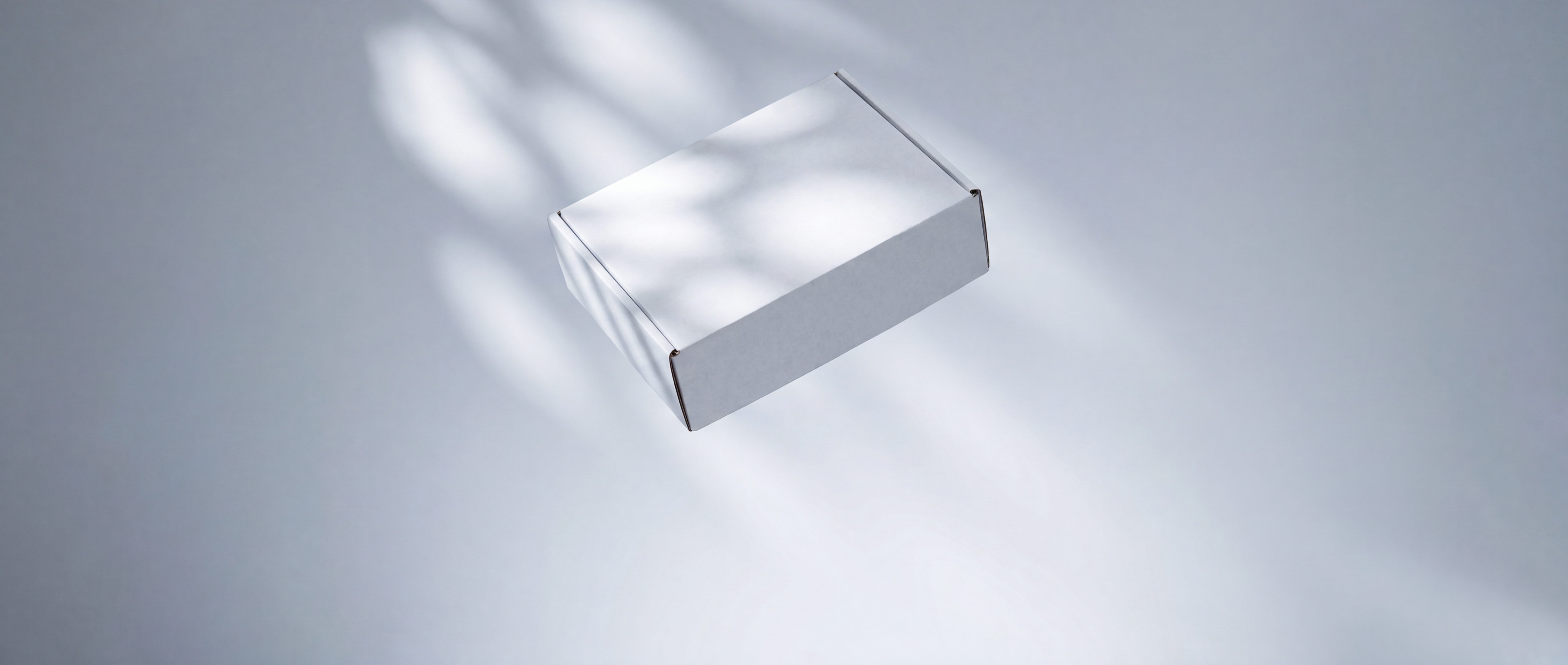 An unmarked plain package on a grey surface